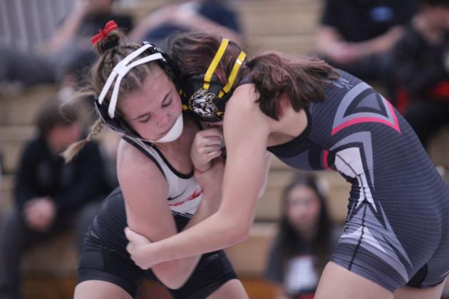 McLoud's Carli Sisco and Tecumseh's Lizzy Hernandez try to take each other down. Natasha Dunagan, Countywide &amp; Sun