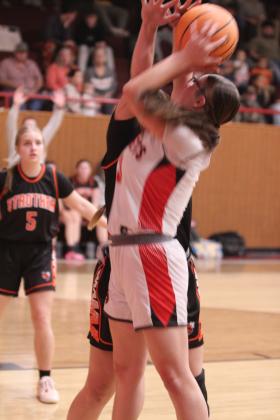 Macomb's Deja Givens grabs the rebound and adds two points.