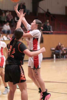 Macomb's Cassi Johnson aims for the bucket during the second quarter of the Jan. 16 home game against Strother.