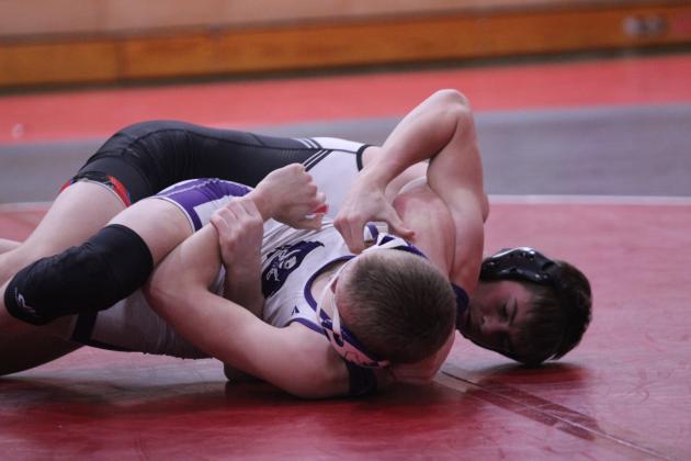 In the 132-weight class, McLoud's Jentry Hudlow focuses on pinning his Mannford opponent during the McLoud Wrestling Tournament on Jan. 22. Overall, McLoud lost to Mannford 30-54. They also faced Harrah and Cushing.