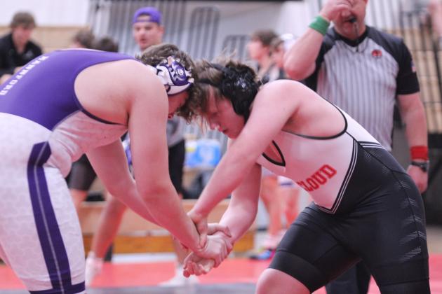 McLoud's Connor McLaughlin, in the 215-weight class, tries to escape the grasp of his Mannford opponent during the McLoud Wrestling Tournament on Jan. 22. Overall, McLoud lost to Mannford 30-54. They also faced Harrah and Cushing.
