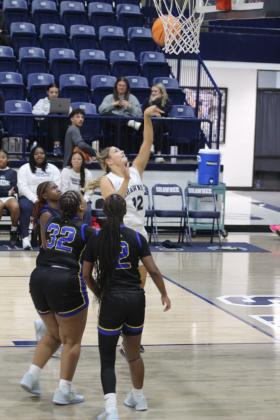Shawnee junior Abigail Clements makes a jump shot and scores during the Jan. 6 home game against Will Rogers. The Lady Wolves won 46-26, and the Wolves followed suit, 82-25. Natasha Dunagan, Countywide &amp; Sun