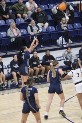 With 10 seconds left in the game, Shawnee senior Daley Rice launches a trey and sinks it in the Jan. 22 game against Midwest City during the Shawnee Invitational. The Lady Wolves lost this hard-fought game 50-54. The day before, they won with Harding Charter 55-19. Natasha Dunagan, Countywide &amp; Sun