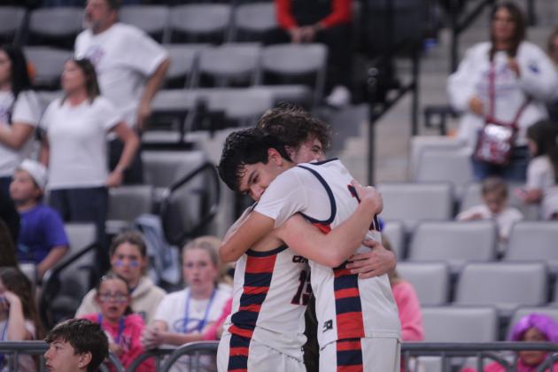 Pierce Aduddell and Casen Foster share a hug after the Asher Indians' loss to Leedey in the Class B2 State Quarterfinal game on March 3 at the OG&amp;E Coliseum in OKC. They end their season with a record of 24-7.