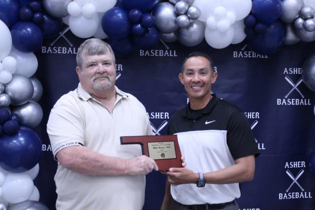 Asher Head Baseball Coach Elliott Alberson, right, presents Asher 1976 graduate Mike Brimm with a Baseball Hall of Fame Award during his induction at the Second Annual Asher Baseball Hall of Fame &amp; Spring Season Kickoff Banquet on March 21.