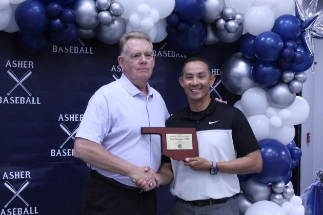 Asher Head Baseball Coach Elliott Alberson presents Asher 1982 graduate and former coach Scott Hamilton with a Baseball Hall of Fame Award during his induction at the Second Annual Asher Baseball Hall of Fame &amp; Spring Season Kickoff Banquet on March 21.