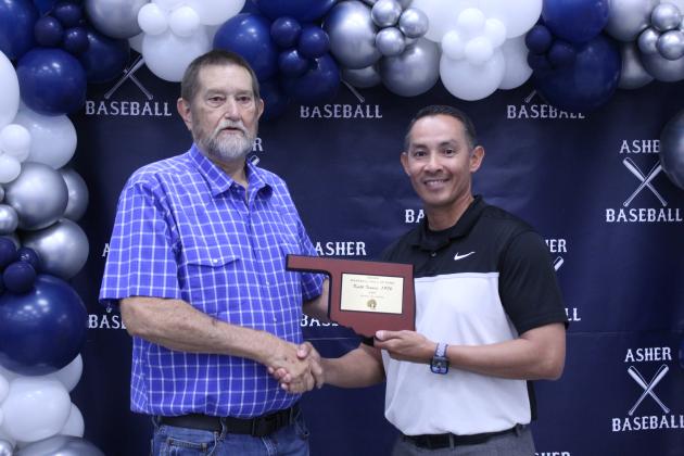 Asher Head Baseball Coach Elliott Alberson, right, presents Asher 1976 graduate Keith Isaacs with a Baseball Hall of Fame Award during his induction at the Second Annual Asher Baseball Hall of Fame &amp; Spring Season Kickoff Banquet on March 21.