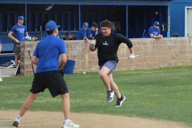 Bethel 2025 graduate Dally Trussell runs home, which is guarded by team member Ryder Davenport, during the Annual Bethel Baseball Alumni Game on Feb. 28. Bethel Baseball Season opened on March 3 against Millwood.