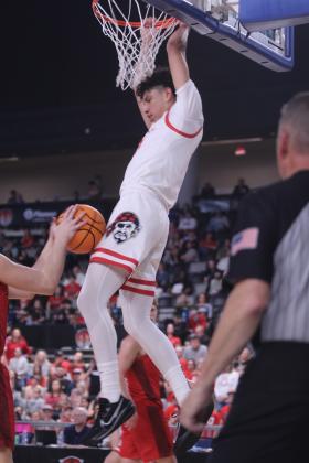 Dale junior Keldan Meely sinks a slam dunk during the second quarter of the Class 2A State Championship against Fairland.