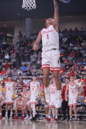 Dale junior Tryson Nash steals the ball and puts it through the bucket during the third quarter of the Class 2A State Championship against Fairland, held at the OG&amp;E Coliseum in OKC on March 14.