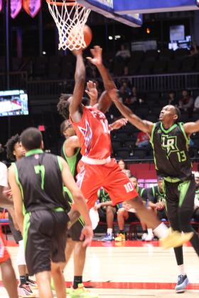 Potawatomi Fire Forward Jeremiah Gilliam grabs the rebound and puts it in the basket at the end of the second quarter of the March 20 home game against the Little Rock Lightning. The Fire won, 121-96, making their record for the season 4-0, according to www.potawatomifire.com.