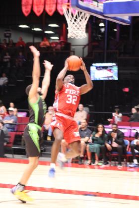 Potawatomi Fire Guard Willie Warren drops in two points in the second quarter of the March 20 home game against the Little Rock Lightning. The Fire won, 121-96, making their record for the season 4-0, according to www.potawatomifire.com.