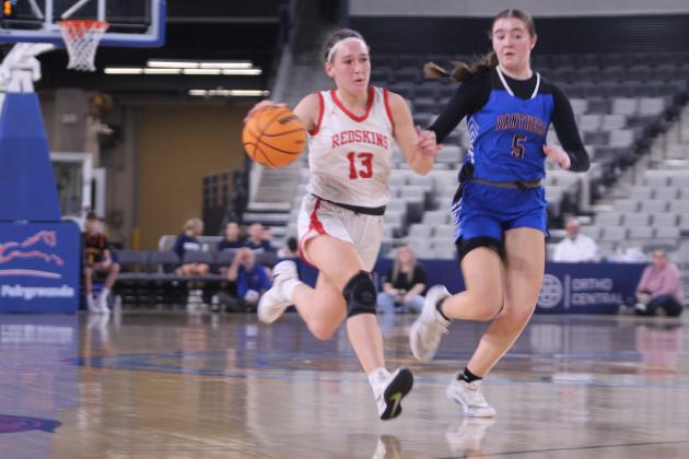 McLoud's Creighton Conley takes it to the hoop during the Class 4A State Quarterfinals against Harrah on March 10.