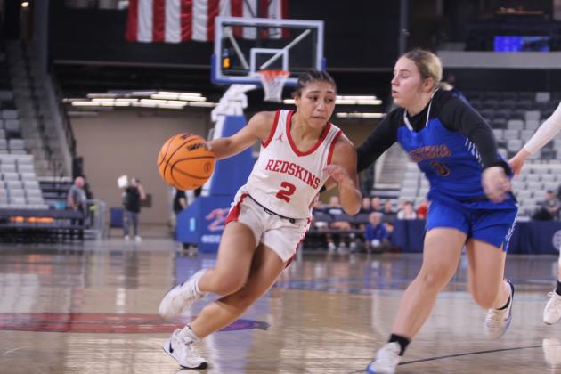 McLoud's Claire Mapira drives to the hoop during the Class 4A State Quarterfinals against Harrah on March 10.