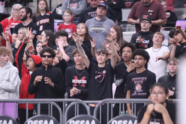 The McLoud Student Section sends out positive thoughts during the Lady Redskins' state quarterfinals game against Harrah on March 10.