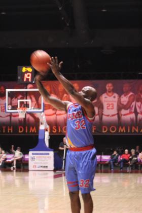 Potawatomi Fire Guard Willie Warren tries for a trey in the first quarter of the March 14 home game against the Muskogee SkyKings. The Fire won, 153-111, which is their 24th win in a row and their 54th consecutive win at the FireLake Arena, according to www.potawatomifire.com.