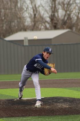 Shawnee sophomore Ethan Berger hurls one over home during the third inning of the home game with Putnam City North on March 7 at their newly-rebuilt facility, complete with turf. The Wolves lost 2-4.