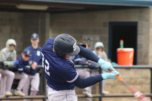 Shawnee sophomore Case Childers hits a single in the home game with Putnam City North on March 7.
