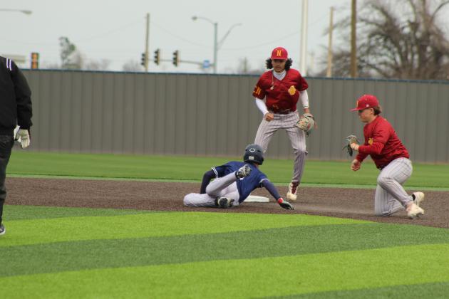 Shawnee sophomore Parker Wells tries to steal second with no luck in the home game with Putnam City North on March 7 at their newly-rebuilt facility, complete with turf.