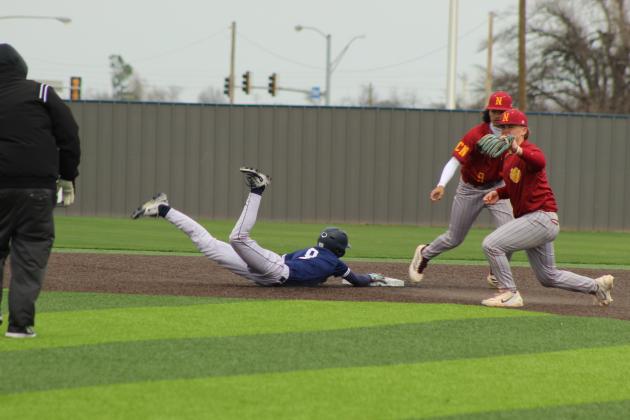 Shawnee sophomore Parker Wells tries to steal second with no luck in the home game with Putnam City North on March 7 at their newly-rebuilt facility, complete with turf.