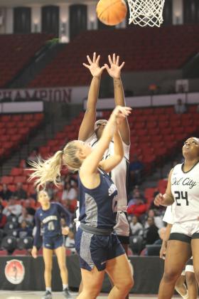 Shawnee junior Abigail Clements aims for the bucket and gets fouled during the third quarter of the Class 5A State Quarterfinal game against Del City, held at the Lloyd Noble Center in Norman on March 12.