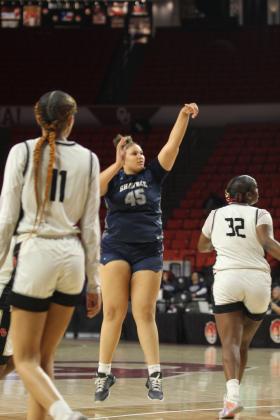 During the last minute of play, Shawnee sophomore Karma Mason launches a three-pointer in the Class 5A State Quarterfinal game against Del City, held at the Lloyd Noble Center in Norman on March 12.