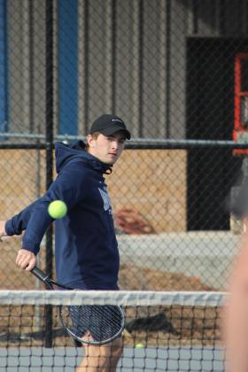Shawnee senior Benji Cole keeps his eye on the ball during the Tennis Scrimmage against Tecumseh at Shawnee's newly completed facility on Feb. 24. THS opened their tennis season on Feb. 26 against Choctaw at home, and SHS also faced Choctaw at home for their first official match on Feb. 27.