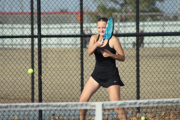 Tecumseh junior Anna Harvey returns the ball during the Tennis Scrimmage at Shawnee's newly completed facility on Feb. 24. THS opened their tennis season on Feb. 26 against Choctaw at home, and SHS also faced Choctaw at home for their first official match on Feb. 27.