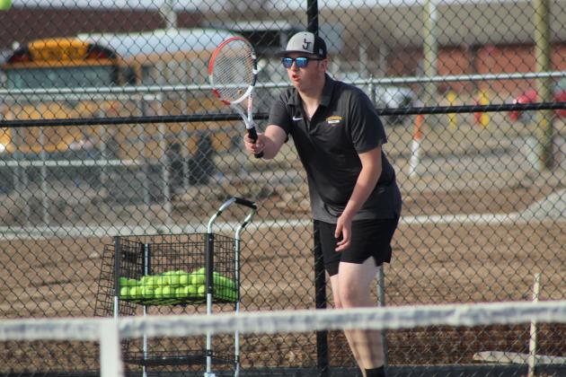 Tecumseh junior Harrison Kinsey stands ready to counter during the Tennis Scrimmage at Shawnee's newly completed facility on Feb. 24. THS opened their tennis season on Feb. 26 against Choctaw at home, and SHS also faced Choctaw at home for their first official match on Feb. 27.