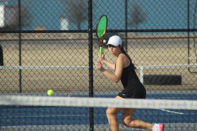 Tecumseh senior Kyann Sells keeps the ball in play during the Tennis Scrimmage at Shawnee's newly completed facility on Feb. 24. THS opened their tennis season on Feb. 26 against Choctaw at home, and SHS also faced Choctaw at home for their first official match on Feb. 27. Photos by Natasha Dunagan, Countywide &amp; Sun