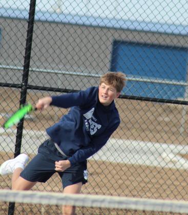 Shawnee junior Jack Timmons serves during the Tennis Scrimmage against Tecumseh at Shawnee's newly completed facility on Feb. 24. THS opened their tennis season on Feb. 26 against Choctaw at home, and SHS also faced Choctaw at home for their first official match on Feb. 27.