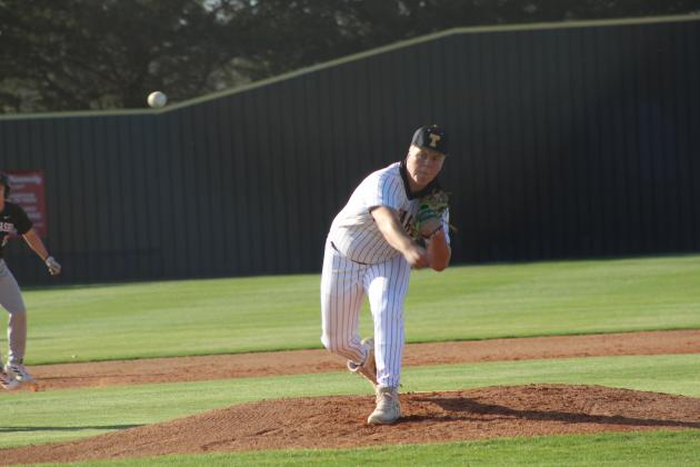 Tecumseh junior Lane Laughlin slings a pitch toward home during the home game against Chickasha on March 9.