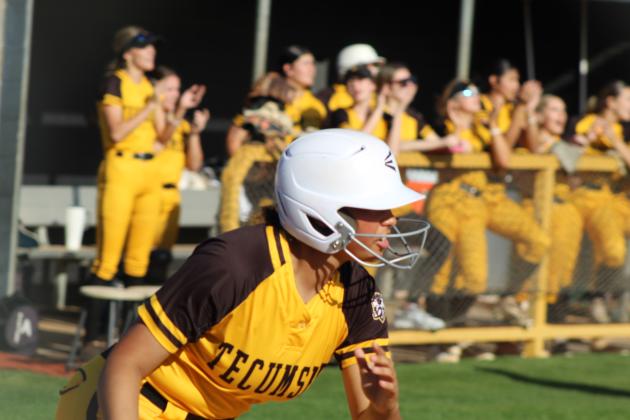 Tecumseh senior Khabrei Simpson hits a double with two RBIs, followed by stealing third and home, during the slow pitch softball season opening game against Seminole on March 9. In the first inning alone, the Lady Savages hit at least 11 doubles, and they won 21-0. Tecumseh Photos by Natasha Dunagan, Countywide &amp; Sun