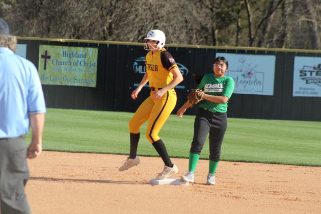 Tecumseh junior Jacee Townsend lands on second during the slow pitch softball season opening game against Seminole on March 9. In the first inning alone, the Lady Savages hit at least 11 doubles, and they won 21-0.