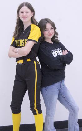 The two sophomores on the Tecumseh High School Slow Pitch Softball Team pose during their first Media Day on Feb. 7. They are Caleigh Lewis and Emmie Reyes. The Lady Savages will have their first home game against Seminole on March 9.