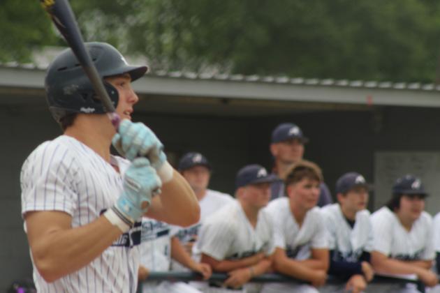 Asher junior Hudson Skender hits a double and watches it fly before running during the first inning of the Class B District Baseball Tournament home game against Macomb on April 22. The Indians won both games that day, 26-0 and 20-0, to become District Champions. Click on the camera banner ad below for more photos from the game!