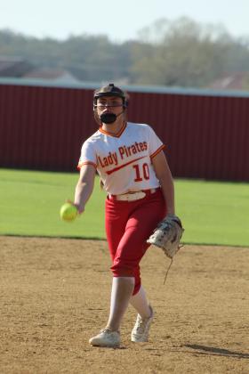 Dale senior Daley Lang lobs the ball toward home during the sixth inning of the March 30 home game against Washington. The Lady Pirates beat the Lady Warriors, 19-14, and they stomped Lexington, 15-0, on the same day.