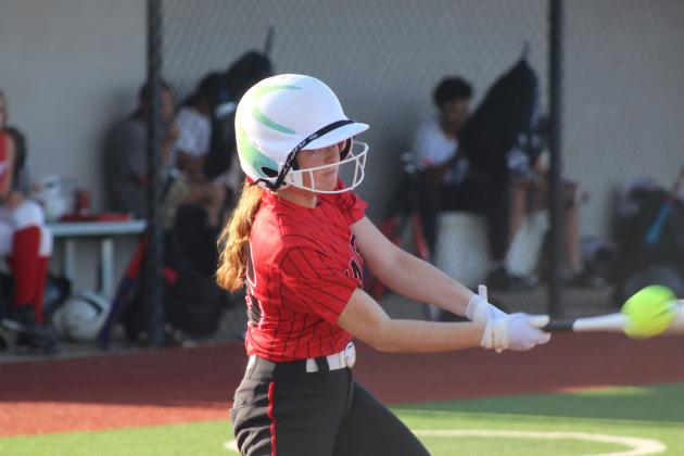 Macomb freshman Lacie Lackey gets a hit before walking during the April 2 game against Earlsboro, played at the BCM Sports Complex in Seminole. The Lady Wildcats beat the Lady Hornets in overtime, 8-7.