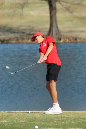 North Rock Creek's Haygen Eubanks prepares to chip toward the ninth hole during the North Canadian River Valley Conference Tournament, held at the Elks Golf Course in Shawnee on March 24. Tecumseh, Bethel and McLoud also participated in the event, and the NRC Lady Cougars placed first as a team, according to a Facebook post on the NRC Public Schools page.