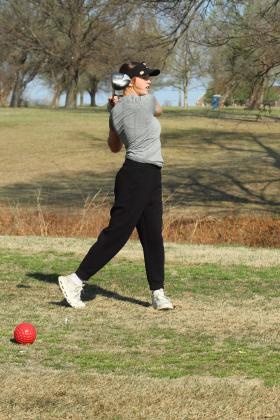 Tecumseh senior Addison Taron drives to the fairway.