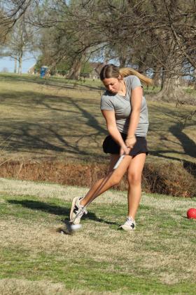 Tecumseh sophomore Jazzy Lozier drives to the fairway during the North Canadian River Valley Conference Tournament, held at the Elks Golf Course on March 24. In addition to the Lady Savages, Tecumseh also brought two boys teams. North Rock Creek, Bethel and McLoud also participated in the event.