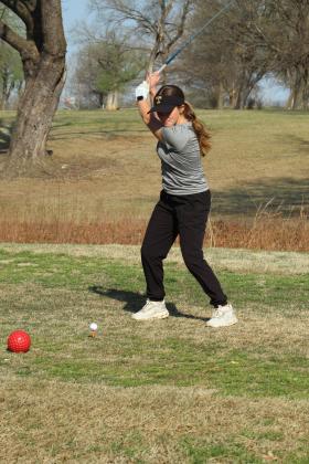 Tecumseh sophomore Madeline Taron drives to the fairway during the North Canadian River Valley Conference Tournament, held at the Elks Golf Course on March 24. In addition to the Lady Savages, Tecumseh also brought two boys teams. North Rock Creek, Bethel and McLoud also participated in the event.