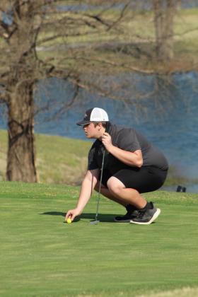 Tecumseh's Wyatt Cosper prepares to putt at the ninth hole during the North Canadian River Valley Conference Tournament, held at the Elks Golf Course in Shawnee on March 24.
