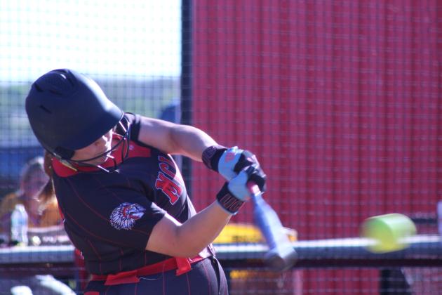 McLoud freshman Ava Ashley sends the ball flying during the April 6 game against Byng at Dale. In the triple-header, the Lady Redskins lost to both Lady Pirates teams: Byng, 0-6, and Dale, 6-16. The Dale Lady Pirates beat Byng, 15-6.