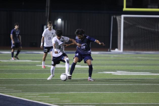 Shawnee's Gabriel Garcia attempts to steal the ball from a Putnam City West player in the March 24 home game. Natasha Dunagan, Countywide &amp; Sun