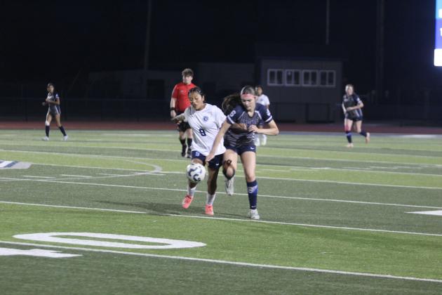 Shawnee's Gemma LaPlant attempts to steal the ball during the March 24 home game against Putnam City West. Natasha Dunagan, Countywide &amp; Sun