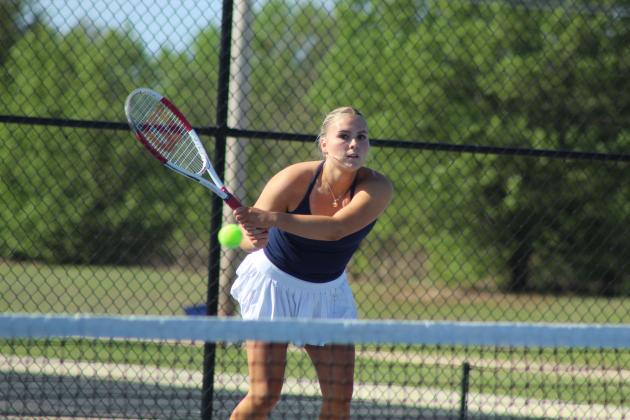 Shawnee junior Masei Hope keeps her eye on the ball during the Shawnee East/West Quad Tournament on March 28.
