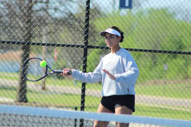 Shawnee senior Anndrea Parada counters with a forehand stroke during the Shawnee East/West Quad Tournament on March 28.