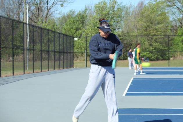 Shawnee sophomore December Nanaeto prepares to return the ball during the Shawnee East/West Quad Tournament on March 28.