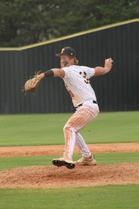 Tecumseh sophomore Cooper Laughlin eyes the batter and winds up his pitch during the April 3 home game against Bethel. The Savages beat the Wildcats, 9-6.